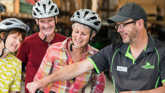 Trail Journeys Team showing cyclist the bikes